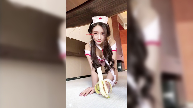 Chinese Yang Mi (中国人杨幂) as a nurse eats a banana 护士吃香蕉 [PREMIUM]