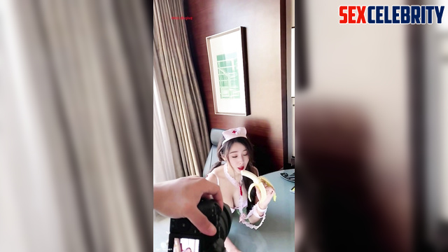 Chinese Yang Mi (中国人杨幂) as a nurse eats a banana 护士吃香蕉 [PREMIUM]