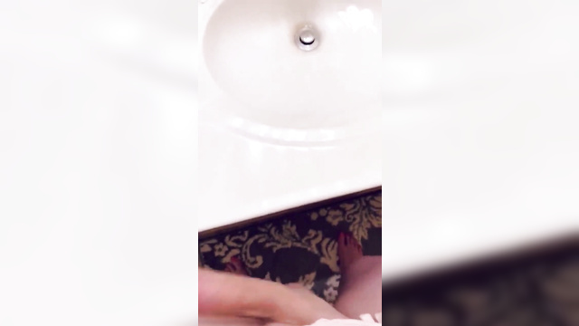 Youtuber Maggie Mae Fish plays with her dick in front of the bathroom mirror