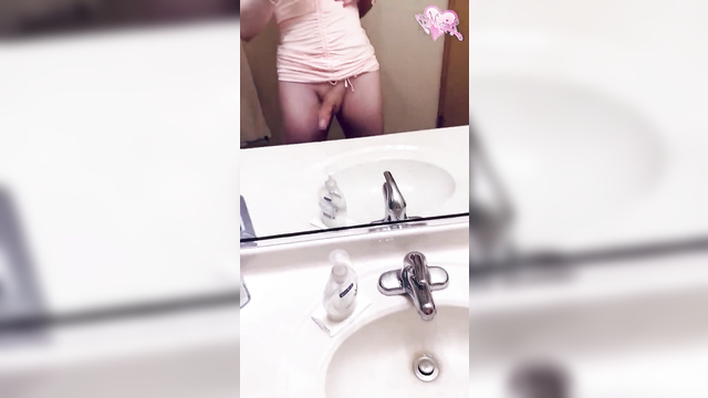 Youtuber Maggie Mae Fish plays with her dick in front of the bathroom mirror
