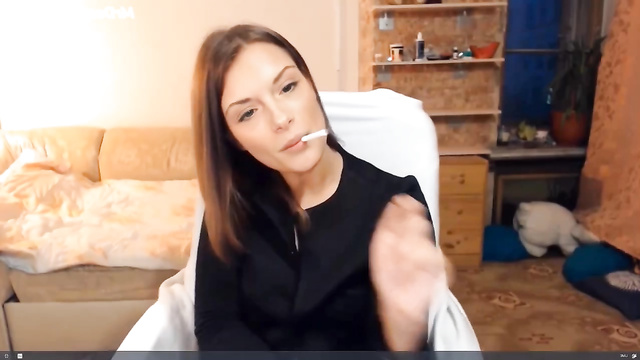 Naked cutie Ashley Hinson smokes a cigarette (boobs show)